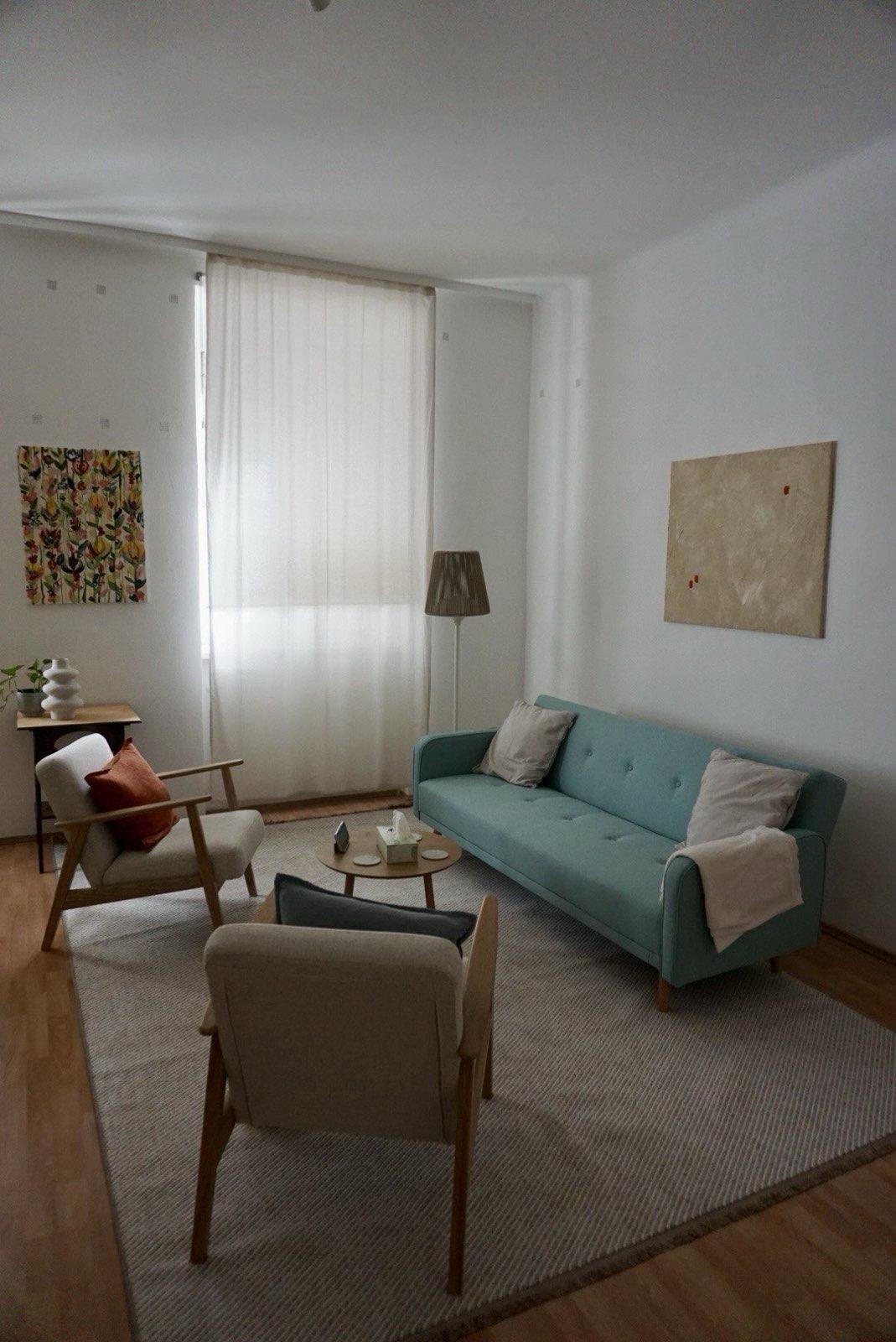 Sofa with two chairs from the side